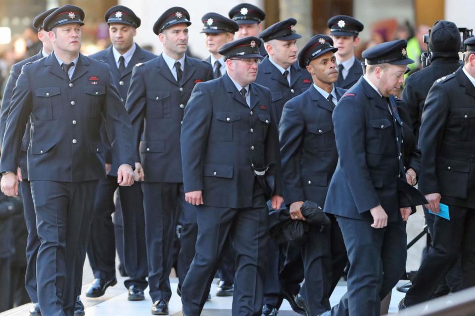 A group of firefighters arriving for the Grenfell Tower National Memorial Service (PA)