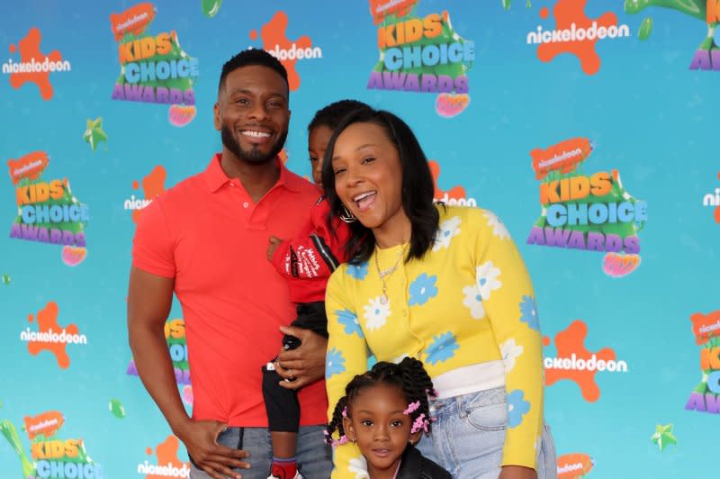 Kel Mitchell, seen with his family, returns in "Good Burger 2." File Photo by Greg Grudt/UPI