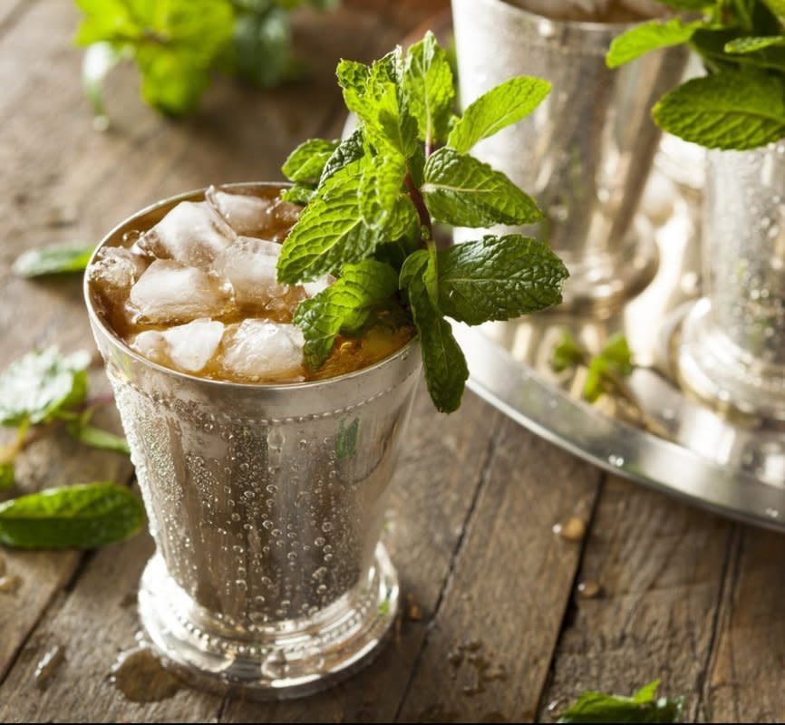 <p>iStock</p><p>The famous Derby cocktail is made with bourbon, simple syrup and mint, then served over crushed ice. <a href="/283135/parade/celebrate-the-kentucky-derby-with-the-ultimate-mint-julep/" data-ylk="slk:Get the recipe HERE!;elm:context_link;itc:0;sec:content-canvas" class="link rapid-noclick-resp">Get the recipe HERE!</a></p>