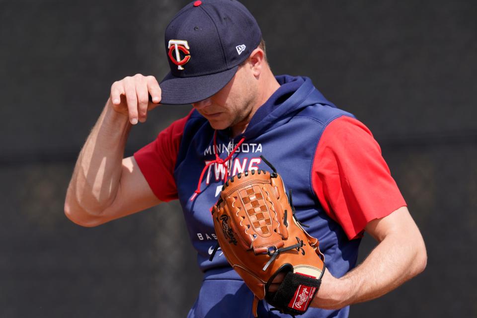 Minnesota Twins pitcher Sonny Gray adjusts his cap during baseball spring training at Hammond Stadium Tuesday March 15, 2022, in Fort Myers, Fla.