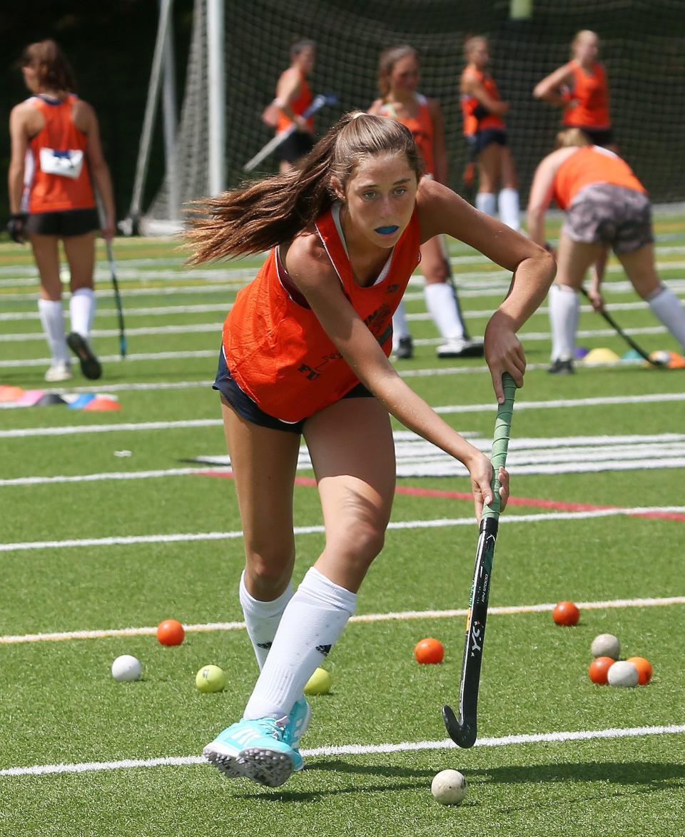 Mamaroneck's Katherine D'Arcy runs through a drill during  field hockey practice at Mamaroneck High School Aug. 22, 2023. 