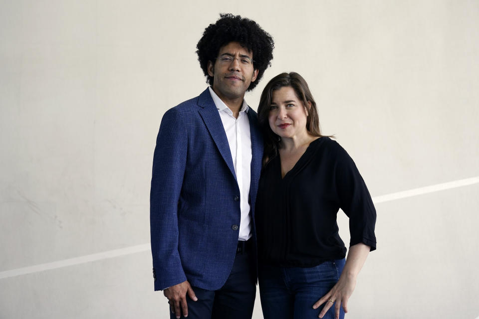 Cellist Alisa Weilerstein, right, and conductor Rafael Payare pose for a portrait at The Rady Shell at Jacobs Park, Wednesday, July 19, 2023, in San Diego. The couple are on a four-concert cross-country run that ends Friday night at Carnegie Hall. (AP Photo/Gregory Bull)