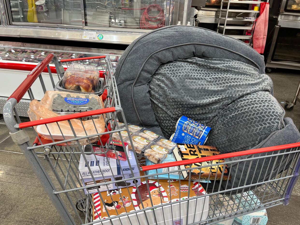 red and gray cart full of food and home goods at costco