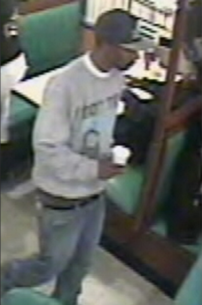 Investigators say this surveillance photo shows a suspect in 2012 since identified as Vallis L. Slaughter holding a Styrofoam cup that would serve as a crucial piece of DNA evidence linking him to a fatal shooting that occurred in the parking lot of a Pennsylvania diner.