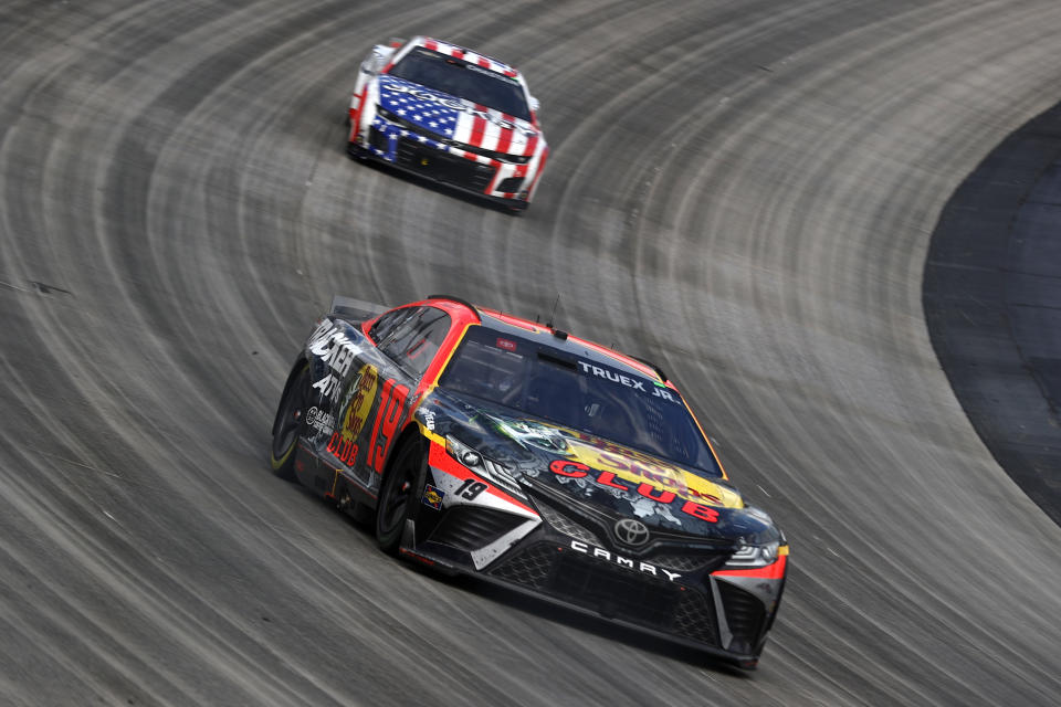 DOVER, DELAWARE - MAY 01: Martin Truex Jr., driver of the #19 Bass Pro Shops Toyota, and Ross Chastain, driver of the #1 Jockey Chevrolet, race during the NASCAR Cup Series Würth 400 at Dover International Speedway on May 01, 2023 in Dover, Delaware. (Photo by Tim Nwachukwu/Getty Images)