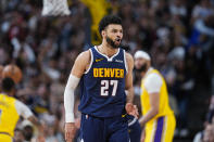Denver Nuggets guard Jamal Murray reacts after hitting a basket in the second half of Game 5 of an NBA basketball first-round playoff series against the Los Angeles Lakers Monday, April 29, 2024, in Denver. (AP Photo/David Zalubowski)