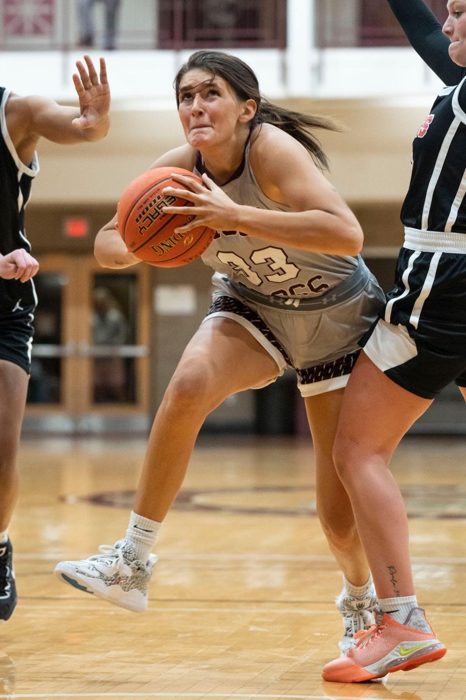 Former Penn player Grace Adams is part of a trio of former local prep talent helping the Holy Cross women's basketball team to new heights this season.