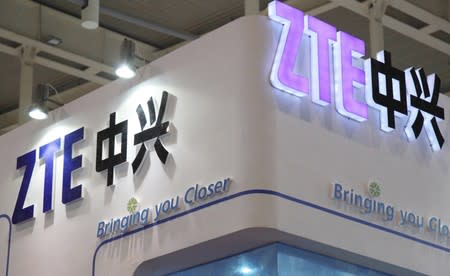 ZTE company logos are seen at an international software and information services exhibition in Nanjing