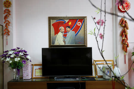 A painting depicting North Korea's leader Kim Jong-un and Vietnamese late leader Ho Chi Minh is seen at the Vietnam-North Korea Friendship kindergarten which was founded by North Korean Government in Hanoi, Vietnam February 13, 2019. Picture taken February 13, 2019. REUTERS/Kham