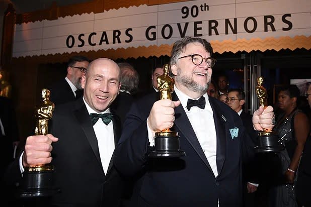Guillermo del Toro (R), winner of the Best Director and Best Picture awards for 'The Shape of Water,' and producer J. Miles Dale