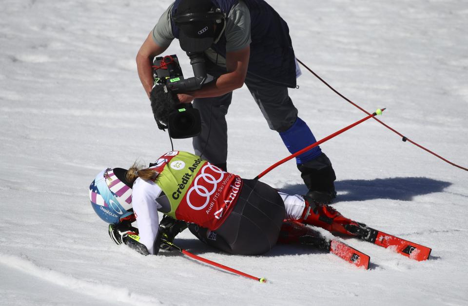 United States' Mikaela Shiffrin is filmed by a cameraman after winning a women's alpine ski giant slalom title, in Soldeu, Andorra, Sunday, March 17, 2019. (AP Photo/Alessandro Trovati)