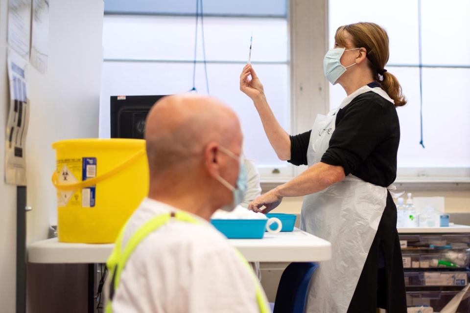 People receive Covid-19 booster vaccinations at Midland House, Derby (PA)