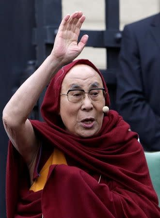 Tibet's exiled spiritual leader the Dalai Lama waves at his supporters during his visit in Prague, Czech Republic, October 17, 2016. REUTERS/David W Cerny