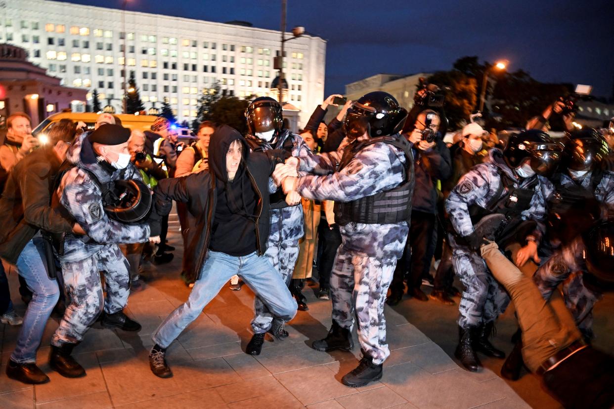 Police officers detain a man in Moscow 