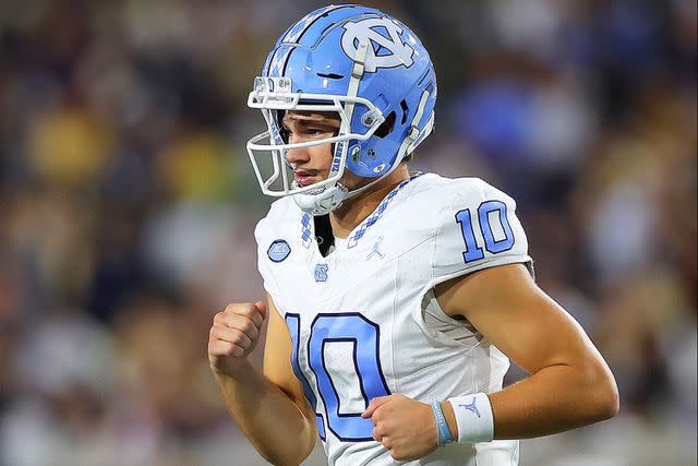 <p>Kevin C. Cox/Getty</p> Drake Maye #10 of the North Carolina Tar Heels reacts after passing for a touchdown against the Georgia Tech Yellow Jackets during the second quarter at Bobby Dodd Stadium on October 28, 2023 in Atlanta, Georgia