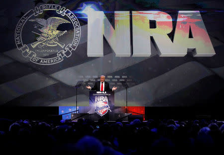 Republican presidential candidate Donald Trump addresses members of the National Rifle Association's during their NRA-ILA Leadership Forum during their annual meeting in Louisville, Kentucky, U.S., May 20, 2016. REUTERS/John Sommers II