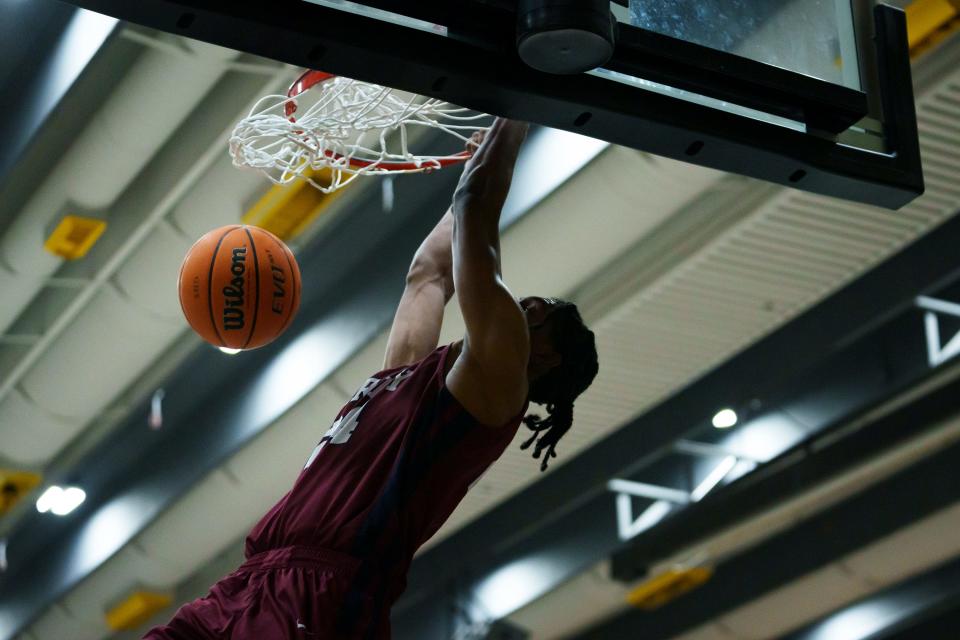 Senior guard, Cody Williams dunks during the Pumas' game against Eastmark in the "Welcome to the Jungle Holiday Tournament" hosted at Gilbert High School on Nov. 21, 2022, in Gilbert.