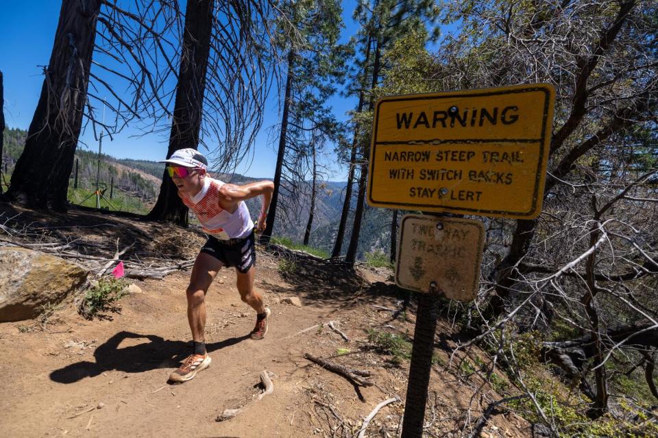 Daniel Jones climbs out of a canyon to Devil's Thumb aid station.