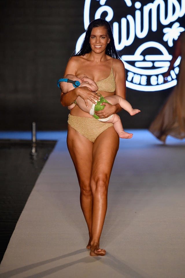 Sports Illustrated model breastfeeds baby in runway show