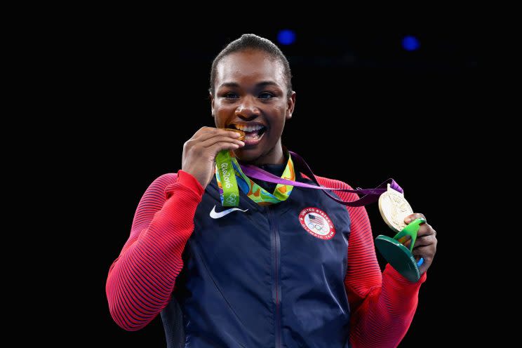 Claressa Shields shows off her two gold medals at the Rio Games. (Getty)