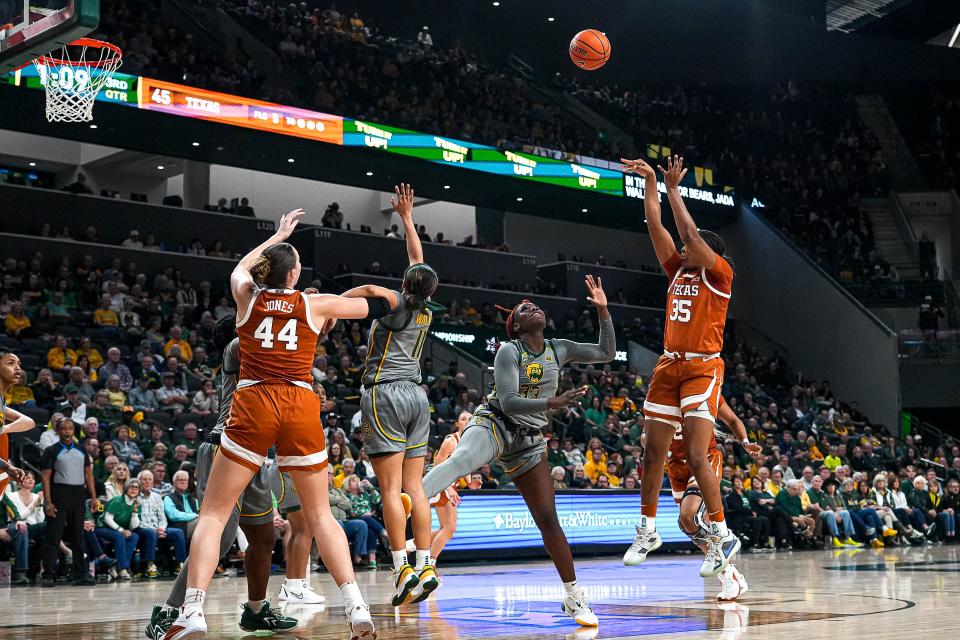 Texas guard Madison Booker shoots over the Baylor defense during Thursday night's 67-55 win in Waco. The freshman scored 22 points, and Aaliyah Moore added 19.