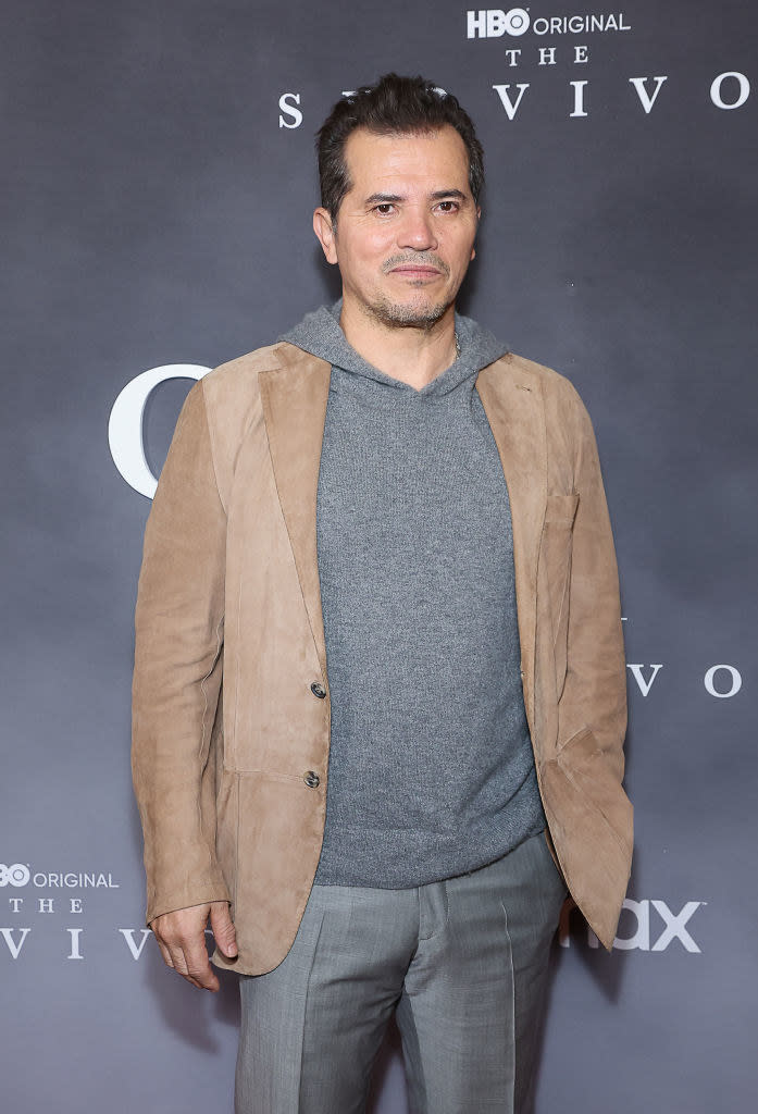 John Leguizamo smiling at an event