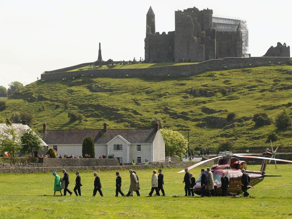 Queen Elizabeth II arrives by helicopter at the Rock of Cashel on May 20, 2011, in Cashel, Ireland.