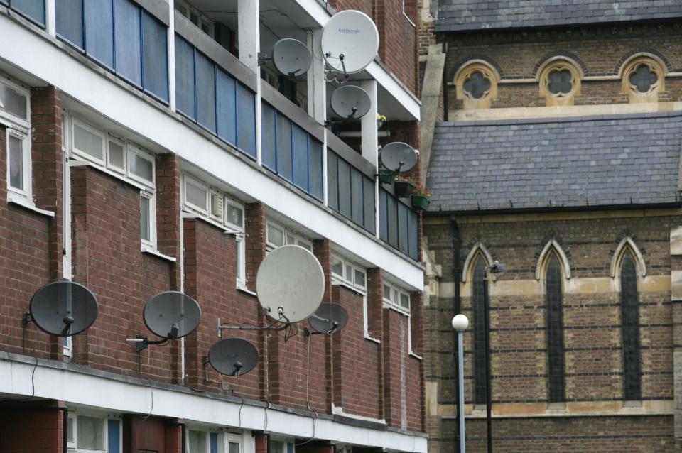 Satellite dishes became a common sight on the walls of UK homes from the 1990s - Martin Pope