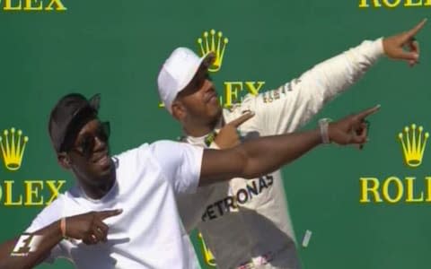 L-R Usain BOlt and Lewis Hamilton - Credit: Formula1.com