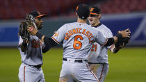 Baltimore Orioles' Cedric Mullins, left, celebrates with Ryan Mountcastle (6) and Austin Hays after the team's 13-1 win over the Boston Red Sox in a baseball game at Fenway Park in Boston, Thursday, Sept. 24, 2020. (AP Photo/Charles Krupa)