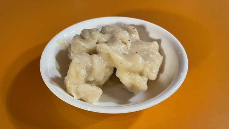 bowl of dumplings in sauce