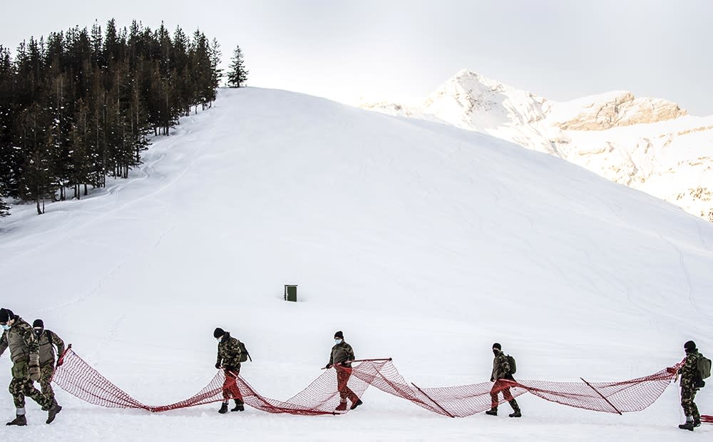 swiss army take down race - jean-christophe bott/shutterstock