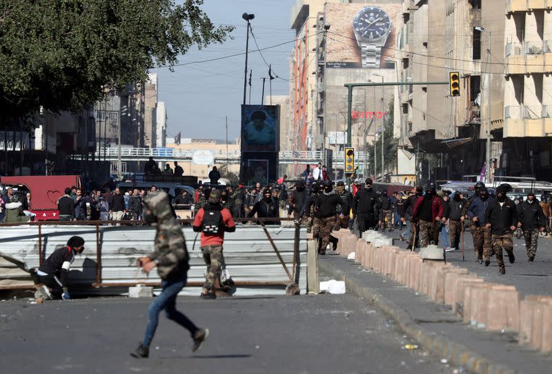 Iraqi demonstrators clash with Iraqi security forces, during ongoing anti-government protests in Baghdad