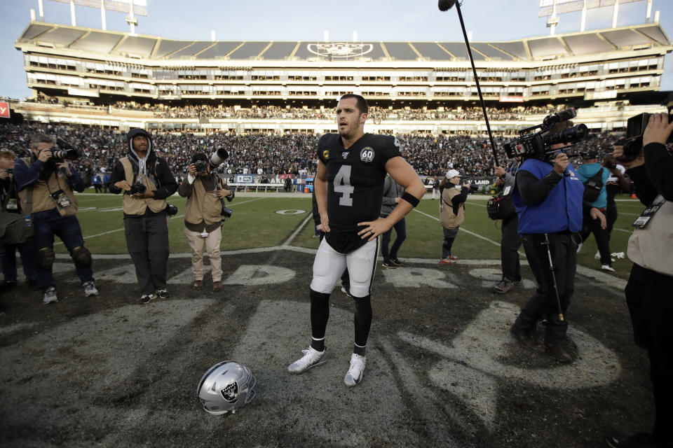 Oakland Raiders quarterback Derek Carr (4) stands on the field at the end of an NFL football game against the Jacksonville Jaguars in Oakland, Calif., Sunday, Dec. 15, 2019. (AP Photo/Ben Margot)