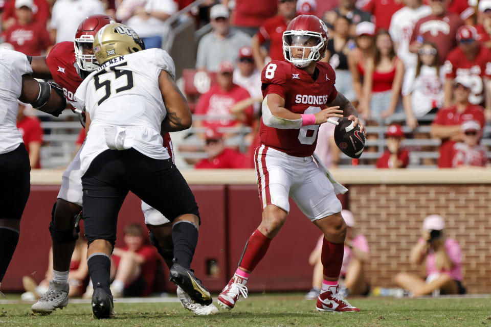 Oklahoma quarterback Dillon Gabriel (8) passes as UCF defensive tackle John Walker (55) tries to pressure in the second half of an NCAA college football game, Saturday, Oct. 21, 2023, in Norman, Okla. (AP Photo/Nate Billings)