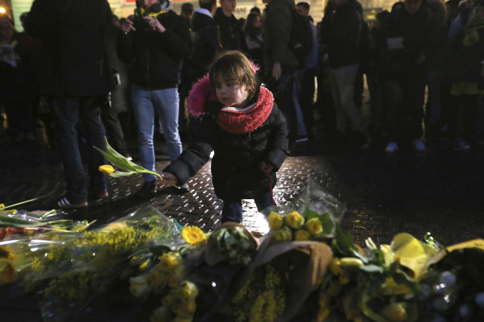 Residents of Nantes, western France, and FC Nantes soccer fans are gathered in the city center to pay tribute to FC Nantes soccer player Emiliano Sala of Argentina, Tuesday, Jan. 22, 2019. The French civil aviation authority said Tuesday, Emiliano Sala was aboard a small passenger plane that went missing off the coast of the island of Guernsey. (AP Photo/David Vincent)