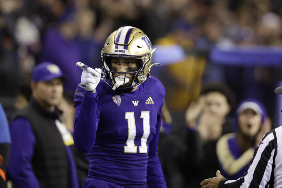 Washington wide receiver Jalen McMillan points to the crowd after catching a pass for a first down against Oregon State during the first half of an NCAA college football game Friday, Nov. 4, 2022, in Seattle. (AP Photo/John Froschauer)