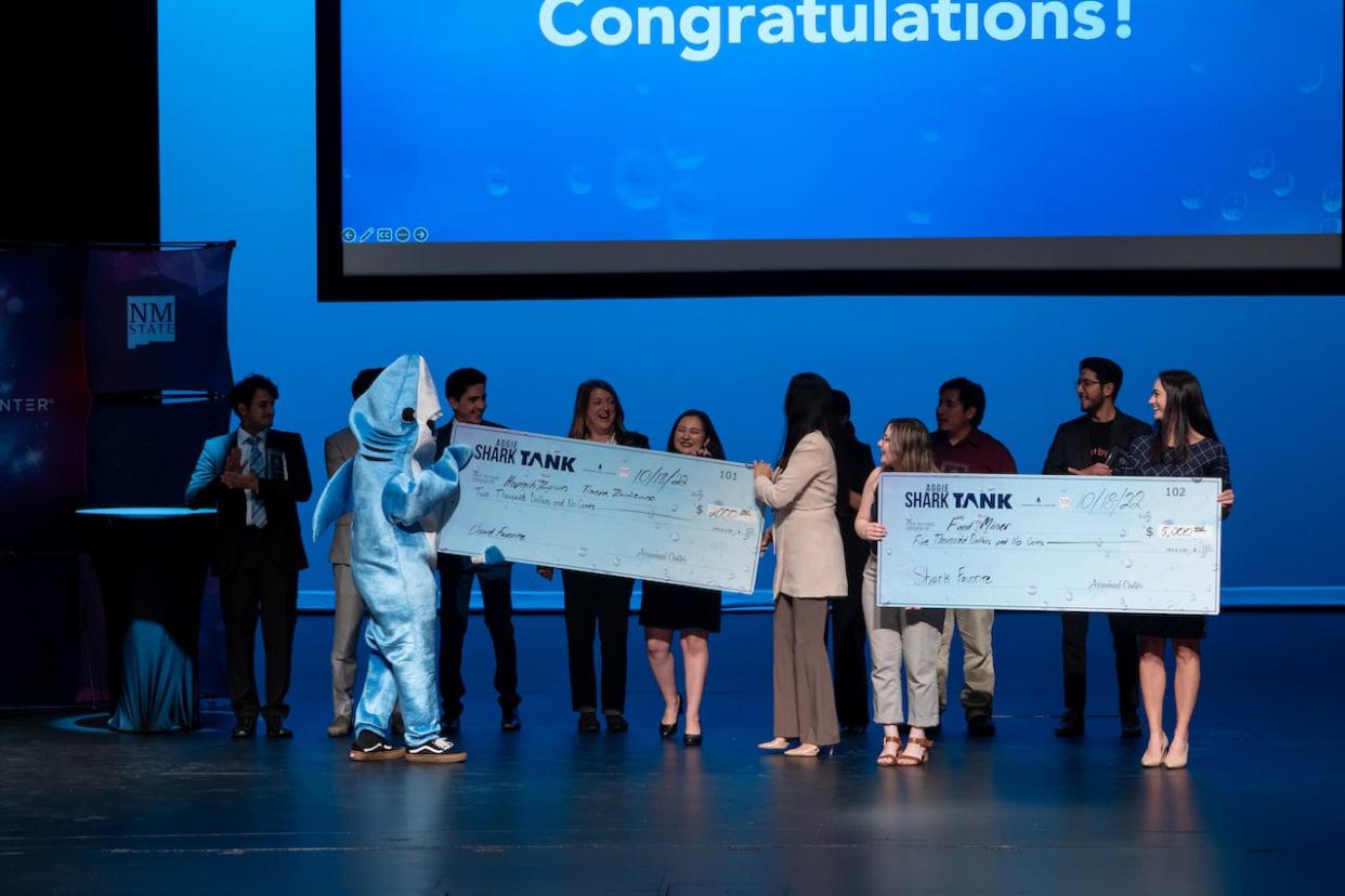 This year’s Aggie Shark Tank awardees, Haptech Zown Communication LLC and FundMiner, accepted their checks at the Oct. 18 event. Students from New Mexico State University and the University at El Paso competed at Aggie Shark Tank, which was hosted by Arrowhead Center Oct 18. at the NMSU Center for the Arts.