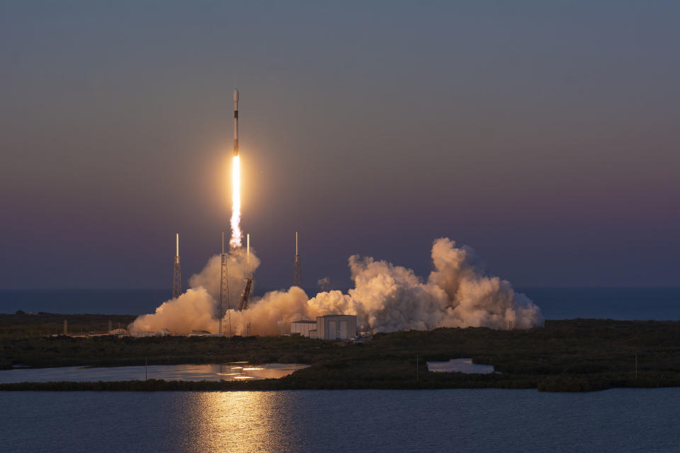 A SpaceX Falcon 9 rocket launches 21 Starlink 