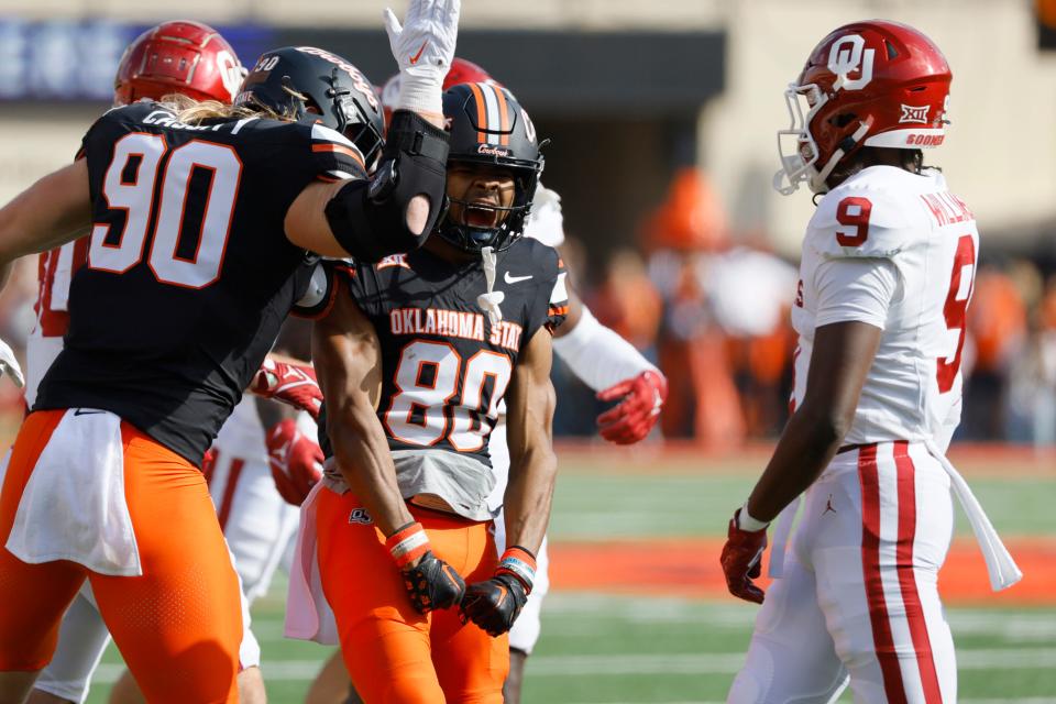Oklahoma State Cowboys wide receiver Brennan Presley (80) celebrates with fullback Braden Cassity (90) after a reception during a Bedlam college football game between the Oklahoma State University Cowboys (OSU) and the University of Oklahoma Sooners (OU) at Boone Pickens Stadium in Stillwater, Okla., Saturday, Nov. 4, 2023.