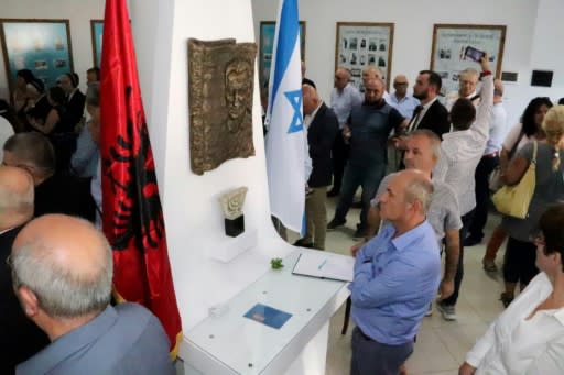 Visitors attend the opening ceremony of the renovated Solomon Jewish hisory museum in the Albanian city of Berat, on September 29, 2019.Albania's sole Jewish history museum reopened in southern Berat on September 29, thanks to a businessman who rescued it from the brink of closure. The small "Solomon Museum", which tells the story of how Muslim and Christian Albanians sheltered hundreds of Jews during the Holocaust, was the passion project of a local professor, Simon Vrusho