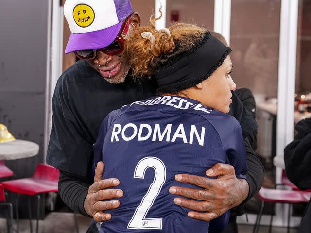 <p>Tony Quinn/ISI Photos/Getty</p> Trinity Rodman (2) with her father, basketball legend Dennis Rodman
