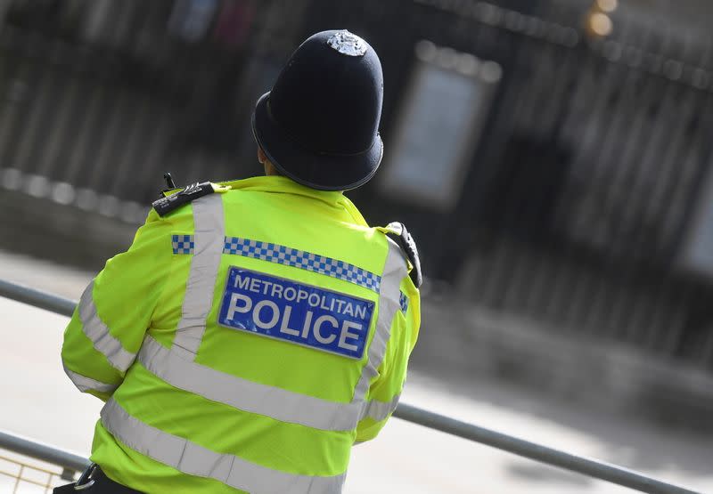 A Metropolitan Police officer stands on duty in London