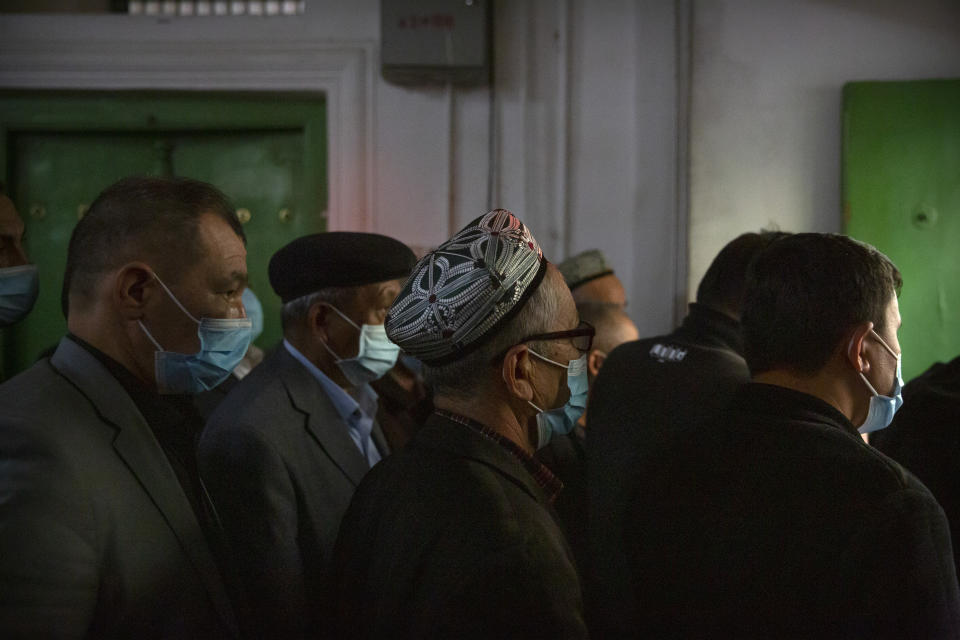 Uyghurs and other members of the faithful leave after prayers at the Id Kah Mosque in Kashgar in western China's Xinjiang Uyghur Autonomous Region, as seen during a government organized trip for foreign journalists, Monday, April 19, 2021. A human rights group is appealing to the United Nations to investigate allegations China's government is committing crimes against humanity in the Xinjiang region. Human Rights Watch cited reports of the mass detention of Muslims, a crackdown on religious practices and other measures against minorities in the northwestern region. (AP Photo/Mark Schiefelbein)