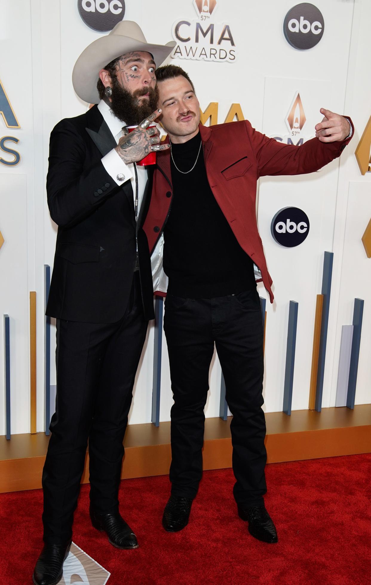 Post Malone and Morgan Wallen walk the red carpet during the 57th Annual Country Music Association Awards in Nashville, Tennessee, Wednesday, Nov. 8, 2023.