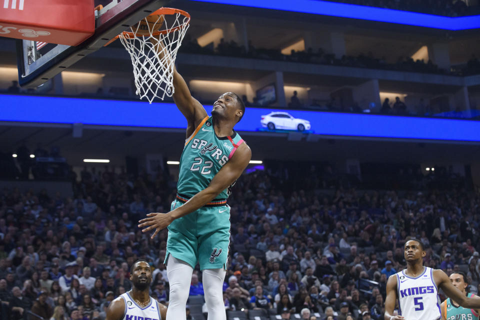 San Antonio Spurs guard Malaki Branham (22) dunks the ball during the first quarter of an NBA basketball game against the Sacramento Kings in Sacramento, Calif., Sunday, April 2, 2023. (AP Photo/Randall Benton)