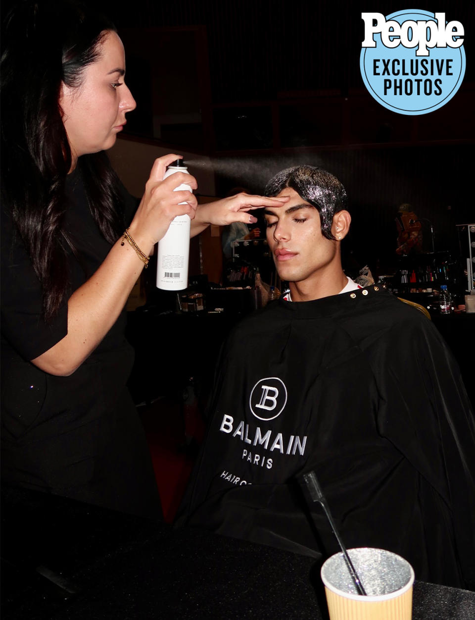 <p>Castellani worked with the Balmain hairstyling team to keep his metallic waves in tact. </p>