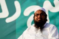 FILE PHOTO - Hafiz Muhammad Saeed, chief of the banned Islamic charity Jamat-ud-Dawa, looks over the crowed as they end a "Kashmir Caravan" from Lahore with a protest in Islamabad, Pakistan July 20, 2016. REUTERS/Caren Firouz/File Photo