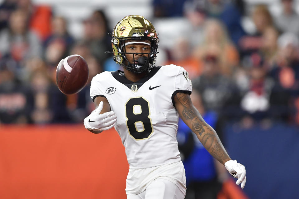 Wake Forest wide receiver Wesley Grimes (8) reacts after scoring during the first half of an NCAA college football game against Syracuse in Syracuse, N.Y., Saturday, Nov. 25, 2023. (AP Photo/Adrian Kraus)