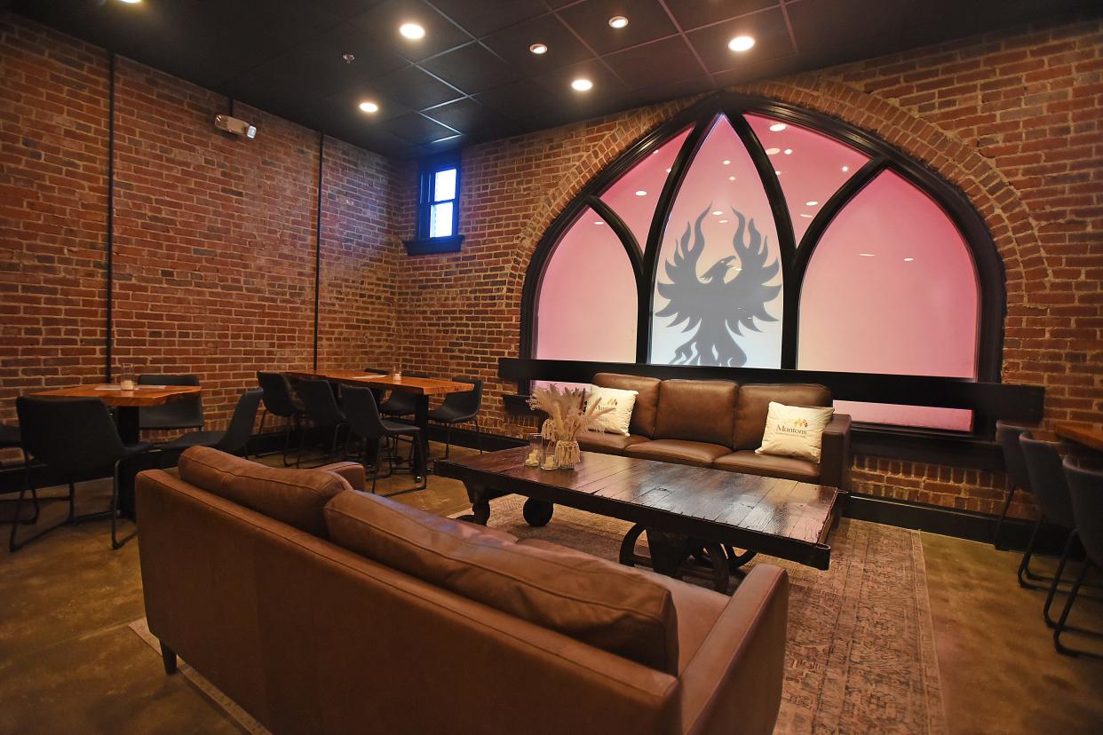 The new Spirit Room at the Phoenix Brewing Company. The iconic Diamond Street window, to which the owners have added their signature Phoenix logo, is the focal point of the new whiskey bar and event space.
